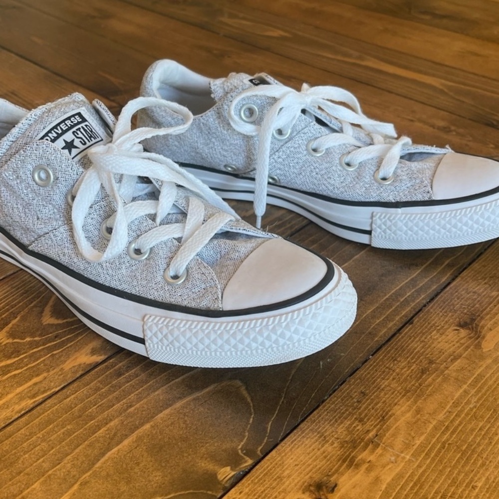Grey and white converse.